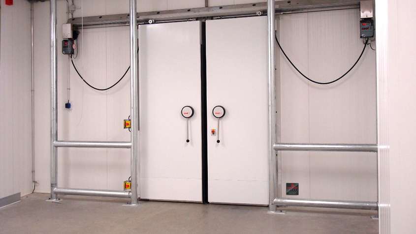 White cold storage sliding door with skirting protection