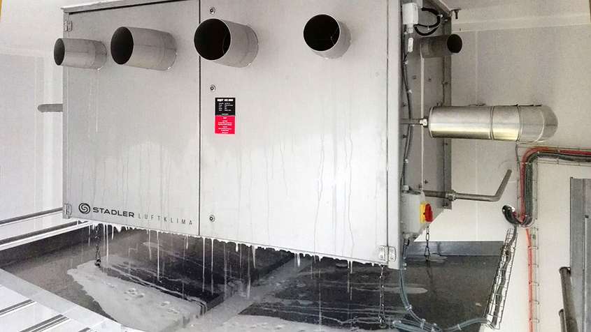 Close-up of an ESJET-device that is releasing foamy water after a fully automated cleaning cycle